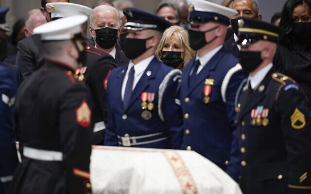 President Joe Biden and first lady Jill Biden watch the casket during a funeral for former Secretary of State Colin Powell at the Washington National Cathedral, in Washington, Friday, Nov. 5, 2021. At right are former President Barack Obama and former first lady Michelle Obama. (AP Photo/Andrew Harnik) President Joe Biden and first lady Jill Biden watch the casket during a funeral for former Secretary of State Colin Powell at the Washington National Cathedral, in Washington, Friday, Nov. 5, 2021. At right are former President Barack Obama and former first lady Michelle Obama. (AP Photo/Andrew Harnik)