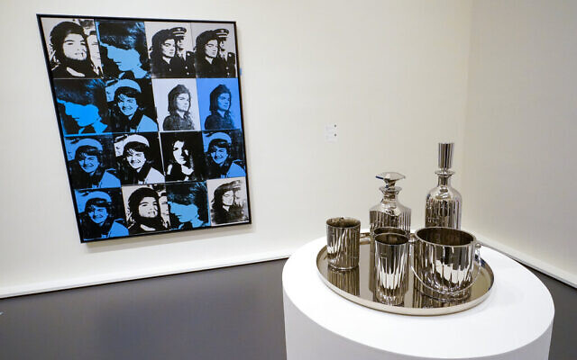Andy Warhol's 'Sixteen Jackies', left, and Jeff Koons' 'Baccarat Crystal Set' are on display at Sotheby's auction house during a press preview for the upcoming The Macklowe Collection auction, Nov. 5, 2021, in New York. (AP Photo/Mary Altaffer) Andy Warhol's 'Sixteen Jackies', left, and Jeff Koons' 'Baccarat Crystal Set' are on display at Sotheby's auction house during a press preview for the upcoming The Macklowe Collection auction, Nov. 5, 2021, in New York. (AP Photo/Mary Altaffer)