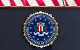 An FBI seal on a podium  before a news conference at the agency's headquarters in Washington, June 14, 2018. (Jose Luis Magana/AP)