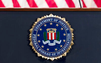 An FBI seal on a podium  before a news conference at the agency's headquarters in Washington, June 14, 2018. (Jose Luis Magana/AP)