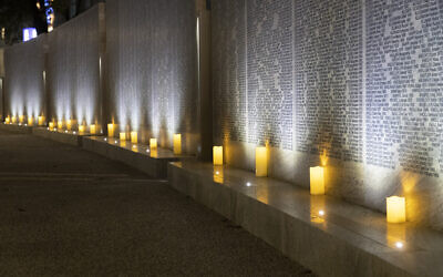 Lights illuminate the Shoah Wall of Names Memorial after the inauguration ceremony, in Vienna, Austria, on November 9, 2021. (AP Photo/Lisa Leutner)