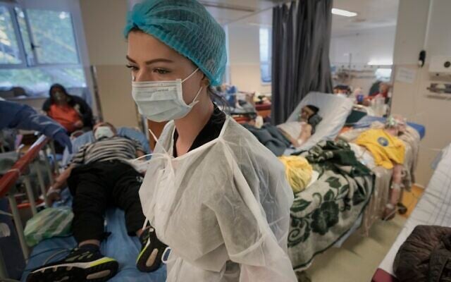 A member of the medical staff walks in a crowded COVID-19 isolation room at the University Emergency Hospital in Bucharest, Romania, Friday, Oct. 22, 2021 (AP Photo/Vadim Ghirda, File) A member of the medical staff walks in a crowded COVID-19 isolation room at the University Emergency Hospital in Bucharest, Romania, Friday, Oct. 22, 2021 (AP Photo/Vadim Ghirda, File)