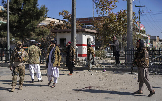 Taliban fighters secure the area after a roadside bomb went off in Kabul Afghanistan, Monday Nov. 15, 2021. (AP Photo/Petros Giannakouris) Taliban fighters secure the area after a roadside bomb went off in Kabul Afghanistan, Monday Nov. 15, 2021. (AP Photo/Petros Giannakouris)