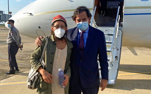 In this photo provided by the Richardson Center, former US Ambassador to the UN Bill Richardson, right, poses with journalist Danny Fenster in Naypyitaw, Myanmar, Monday, Nov. 15, 2021. (The Richardson Center via AP)