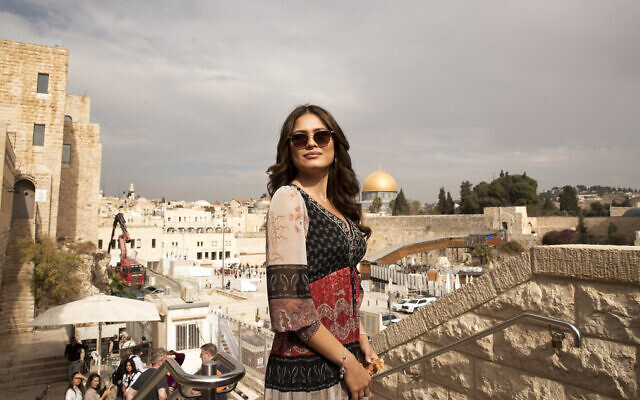 Andrea Meza, the reigning Miss Universe from Mexico, poses overlooking the Western Wall and the Dome of the Rock as she tours the Old City of Jerusalem, on November 17, 2021. (AP Photo/Maya Alleruzzo)