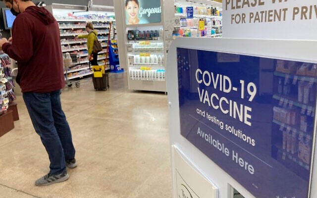 A patient waits to be called for a COVID-19 vaccination booster shot outside a pharmacy in a grocery store, on November 3, 2021, in downtown Denver. (AP Photo/David Zalubowski, File) A patient waits to be called for a COVID-19 vaccination booster shot outside a pharmacy in a grocery store, on November 3, 2021, in downtown Denver. (AP Photo/David Zalubowski, File)