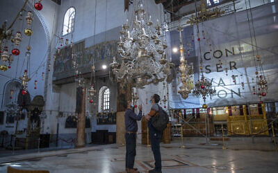 Tourists visit the Church of the Nativity, in the West Bank city of Bethlehem, on November 16, 2021. (AP Photo/Nasser Nasser)