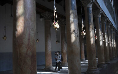 Tourists visit the Church of the Nativity, in the West Bank city of Bethlehem, November 16, 2021. (AP Photo/Nasser Nasser) Tourists visit the Church of the Nativity, in the West Bank city of Bethlehem, November 16, 2021. (AP Photo/Nasser Nasser)
