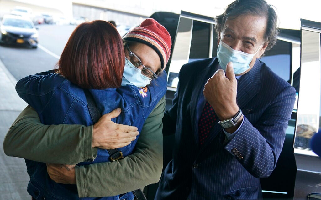 Danny Fenster, center, hugs his mother Rose Fenster as former U.S. diplomat Bill Richardson, right, looks on at John F. Kennedy Airport in New York, Tuesday, Nov. 16, 2021. (AP Photo/Seth Wenig) Danny Fenster, center, hugs his mother Rose Fenster as former U.S. diplomat Bill Richardson, right, looks on at John F. Kennedy Airport in New York, Tuesday, Nov. 16, 2021. (AP Photo/Seth Wenig)