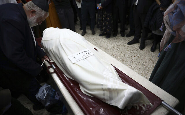 Mourners gather around the body of Eliyahu Kay, a 26-year-old immigrant from South Africa, during his funeral the day after he was killed when a Palestinian terrorist opened fire in the Old City of Jerusalem, Monday, Nov. 22, 2021. (AP Photo/Oded Balilty) Mourners gather around the body of Eliyahu Kay, a 26-year-old immigrant from South Africa, during his funeral the day after he was killed when a Palestinian terrorist opened fire in the Old City of Jerusalem, Monday, Nov. 22, 2021. (AP Photo/Oded Balilty)