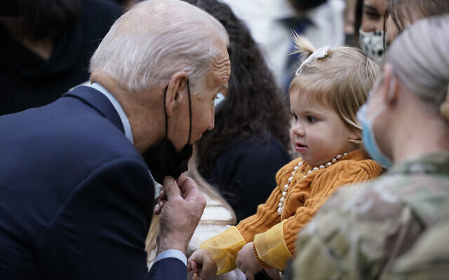 President Joe Biden greets a young child US during a visit to Fort Bragg to mark the upcoming Thanksgiving holiday, Monday, Nov. 22, 2021, in Fort Bragg, N.C. (AP Photo/Evan Vucci) President Joe Biden greets a young child US during a visit to Fort Bragg to mark the upcoming Thanksgiving holiday, Monday, Nov. 22, 2021, in Fort Bragg, N.C. (AP Photo/Evan Vucci)