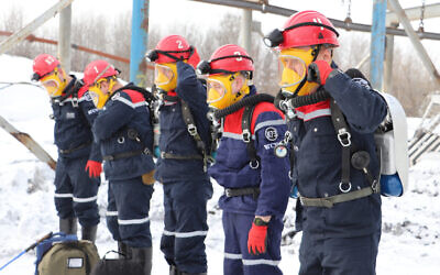 Rescuers prepare to work at a fire scene at a coal mine near the Siberian city of Kemerovo, about 3,000 kilometers (1,900 miles) east of Moscow, Russia, November 25, 2021. (Russian Ministry for Emergency Situations photo via AP)