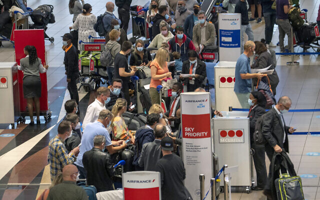 People line up to get on the Air France flight to Paris at OR Tambo International Airport in Johannesburg, South Africa, Friday Nov. 26, 2021. (AP Photo/Jerome Delay) People line up to get on the Air France flight to Paris at OR Tambo International Airport in Johannesburg, South Africa, Friday Nov. 26, 2021. (AP Photo/Jerome Delay)