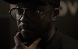American musician will.i.am, front man for Black Eyed Peas, listens during an interview in Jerusalem, on November 29, 2021. (AP Photo/ Maya Alleruzzo)