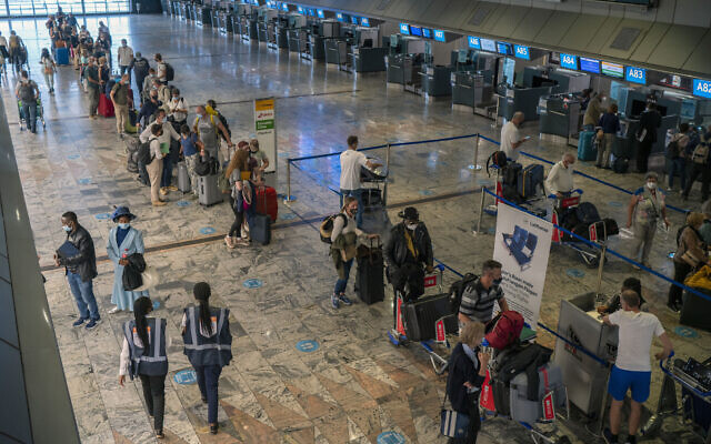 Passengers check in at the Lufthansa counter at Johannesburg's OR Tambo's airport, on November 29, 2021. (AP Photo/Jerome Delay) Passengers check in at the Lufthansa counter at Johannesburg's OR Tambo's airport, on November 29, 2021. (AP Photo/Jerome Delay)