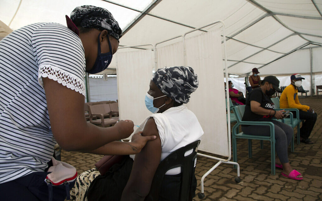 A woman receives a dose of a COVID-19 vaccine at a center, in Soweto, South Africa, on Monday, November 29, 2021. (AP Photo/Denis Farrell) A woman receives a dose of a COVID-19 vaccine at a center, in Soweto, South Africa, on Monday, November 29, 2021. (AP Photo/Denis Farrell)