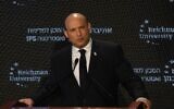 Prime Minister Naftali Bennett speaks at IPS conference at Reichman University, November 23, 2021 (Amos Ben Gershom/GPO)