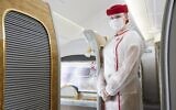 An Emirates airline cabin crew member poses on one of the United Arab Emirates flag-carrier planes. (Emirates Airlines PR)