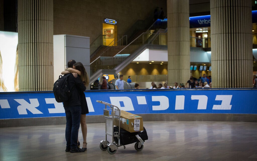 A couple reunites in the arrival hall of Ben Gurion Airport. (Miriam Alster/FLASH90) A couple reunites in the arrival hall of Ben Gurion Airport. (Miriam Alster/FLASH90)