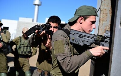Infantry soldiers from the Golani Brigade train in underground tunnel urban warfare at a mock Arab village on the Golan Heights on May 15, 2021. (Michael Giladi/Flash90)