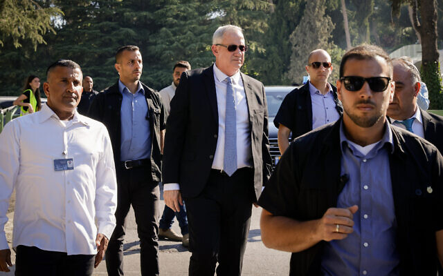Defense Benny Gantz, escorted by security guards, at Mount Herzl national cemetery in Jerusalem, on June 20, 2021. (Olivier Fitoussi/Flash90) Defense Benny Gantz, escorted by security guards, at Mount Herzl national cemetery in Jerusalem, on June 20, 2021. (Olivier Fitoussi/Flash90)