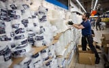 Disposable plastic tableware for sale in Givat Shaul, Jerusalem, October 27, 2021 (Yonatan Sindel/Flash90)