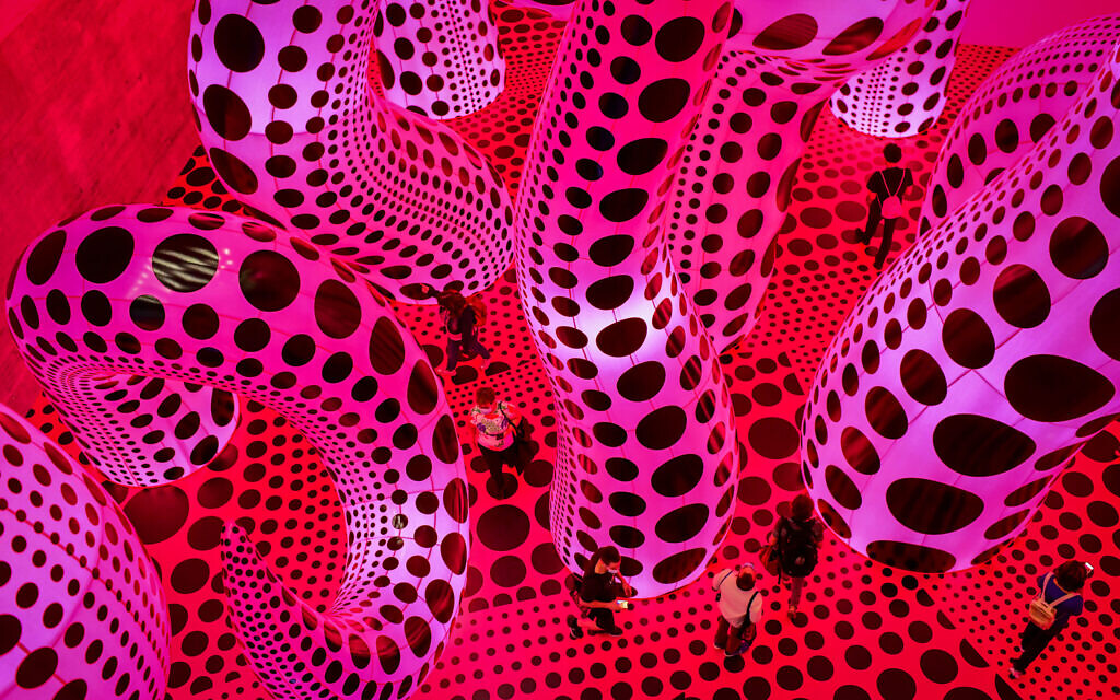 The enormous hot pink inflatables installation at the Tel Aviv Museum of Art exhibition of Japanese artist Yayoi Kusama on October 31, 2021 (Photo by Tomer Neuberg/Flash90)
