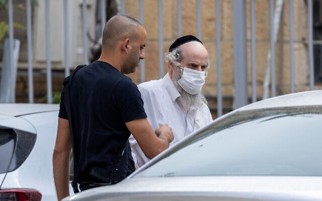 Tzvi Tzucker is seen outside the Jerusalem Magistrate's Court on November 1, 2021 (Yonatan Sindel/Flash90) Tzvi Tzucker is seen outside the Jerusalem Magistrate's Court on November 1, 2021 (Yonatan Sindel/Flash90)