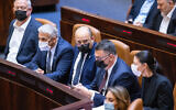 Prime Minister Naftali Bennett (C) and other government ministers attend the final votes on the state budget, at the Knesset in Jerusalem, November 3, 2021. (Olivier Fitoussi/Flash90)