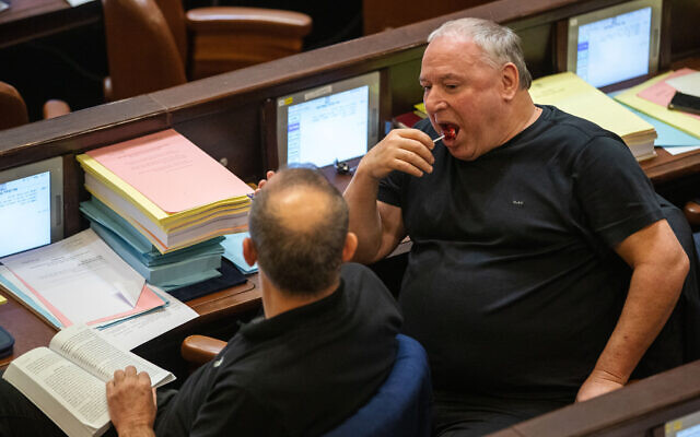 Lawmakers eat lollipops in the Knesset in Jerusalem on November 3, 2021 (Olivier Fitoussi/Flash90) Lawmakers eat lollipops in the Knesset in Jerusalem on November 3, 2021 (Olivier Fitoussi/Flash90)