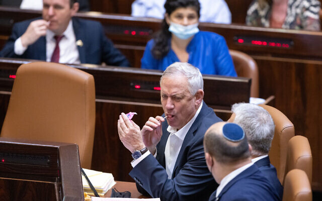 Defense Minister Benny Gantz eats a lollipop in the Knesset in Jerusalem on November 3, 2021 (Olivier Fitoussi/Flash90) Defense Minister Benny Gantz eats a lollipop in the Knesset in Jerusalem on November 3, 2021 (Olivier Fitoussi/Flash90)