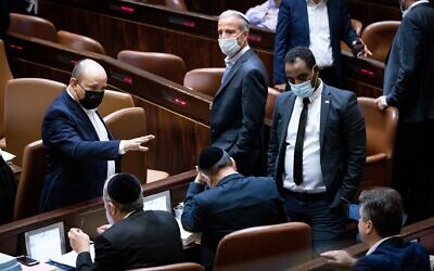Prime Minister Naftali Bennett gestures during voting on the state budget at the Knesset in Jerusalem on November 4, 2021. (Yonatan Sindel/Flash90)