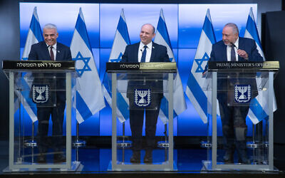 Israeli Prime Minister Naftali Bennett, Minister of Foreign Affairs Yair Lapid (left) and Finance Minister Avigdor Liberman give a press conference in Jerusalem on November 6, 2021. (Ohad Zwigenberg/POOL)