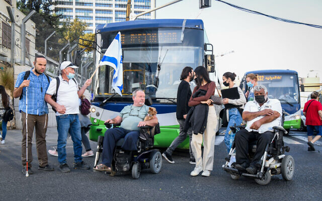 Disability activists block the Ayalon Highway in Tel Aviv during a protest on November 11, 2021. (Flash90)