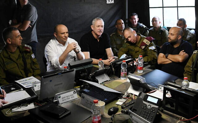 From left to right: IDF Chief of Staff Aviv Kohavi, Prime Minister Naftali Bennett and Defense Minister Benny Gantz attend a military drill in northern Israel on November 16, 2021. (Amos Ben-Gershom/GPO) From left to right: IDF Chief of Staff Aviv Kohavi, Prime Minister Naftali Bennett and Defense Minister Benny Gantz attend a military drill in northern Israel on November 16, 2021. (Amos Ben-Gershom/GPO)
