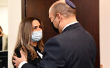 Prime Minister Naftali Bennett meets with Natali Oknin in his office on November 22, 2021. (Haim Zach / GPO)