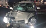 In this photo provided by police on November 5, 2021, a car used in a ramming attack on Border Police officers is seen near the Qalandiya checkpoint, October 14, 2021. (Israel Police)