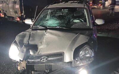 In this photo provided by police on November 5, 2021, a car used in a ramming attack on Border Police officers is seen near the Qalandiya checkpoint, October 14, 2021. (Israel Police)