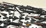 A machine gun and other illegal weapons sezied in police raids for arms in the Arab community, November 9, 2021. (Israel Police)