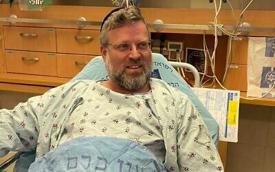 Rabbi Zeev Katzenelnbogen speaking from his bed at Hadassah Ein Kerem hospital after being injured in a terror attack in Jerusalem's Old City, November 21, 2021. (Hadassah Medical Center/courtesy) Rabbi Zeev Katzenelnbogen speaking from his bed at Hadassah Ein Kerem hospital after being injured in a terror attack in Jerusalem's Old City, November 21, 2021. (Hadassah Medical Center/courtesy)