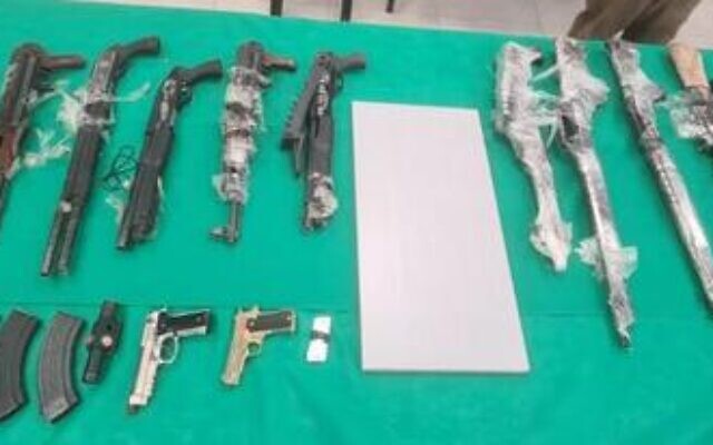 Weapons seized by Israeli security forces during a gun-smuggling attempt along the border with Jordan on November 11, 2021. (Israel Defense Forces) Weapons seized by Israeli security forces during a gun-smuggling attempt along the border with Jordan on November 11, 2021. (Israel Defense Forces)