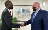 Israeli Finance Minister Avigdor Liberman (right) meets with Wally Adeyemo, the deputy secretary of the US treasury, in Jerusalem on November 14, 2021. (Finance Ministry spokesperson's office)