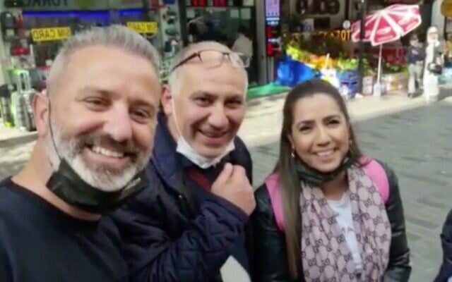 Screen capture from video of Mordy Oknin, left, and his wife Natali, right, with an unidentified Turkish man, on a street in Istanbul, November 2021. (Channel 12 news) Screen capture from video of Mordy Oknin, left, and his wife Natali, right, with an unidentified Turkish man, on a street in Istanbul, November 2021. (Channel 12 news)