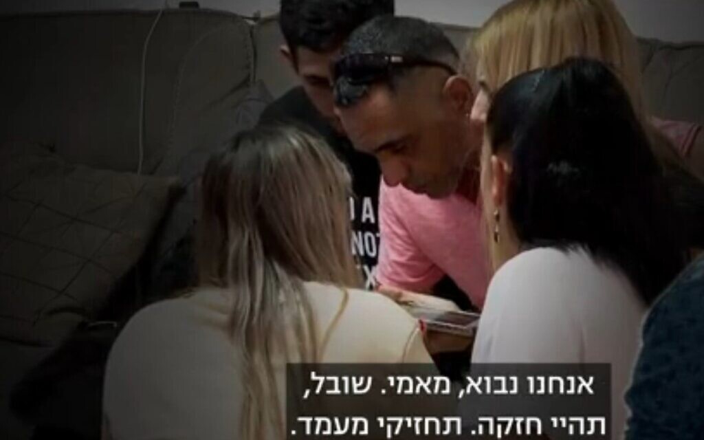 The family of Natali and Mordy Oknin speak by phone with Natali on November 17, 2021, for the first time since she and her husband were arrested eight days earlier in Turkey. The couple, both Egged bus drivers, are being held separately and face espionage accusations, which they and the Israeli government firmly deny. (Channel 13 screenshot)