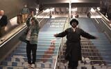 Screenshot from a video of Kosha Dillz, left, and Nissim Black performing across Midtown Manhattan in the video to 'The Hanukkah Song 2.0.' (JTA)