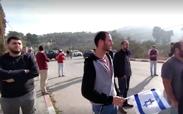 Screen capture from video of a demonstration by Israeli settlers in the northern West Bank against stone throwing attacks on vehicles by Palestinians, November 25, 2021. (Ynet) Screen capture from video of a demonstration by Israeli settlers in the northern West Bank against stone throwing attacks on vehicles by Palestinians, November 25, 2021. (Ynet)