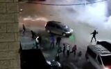 Palestinian rioters clash with Israeli police at the entrance to Jerusalem's Shuafat Refugee Camp, November 21, 2021. (Screenshot: Twitter)