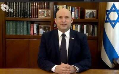 Prime Minister Naftali Bennett addresses the Fifth Annual Christian Media Summit in Jerusalem, on November 11, 2021. (YouTube/screenshot)