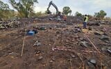 Dozens of mortar shells and other munitions are laid out on the ground next to a recently discovered Syrian bunker on the Golan Heights on November 2, 2021. (Defense Ministry)