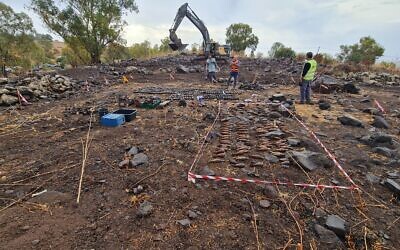 Dozens of mortar shells and other munitions are laid out on the ground next to a recently discovered Syrian bunker on the Golan Heights on November 2, 2021. (Defense Ministry)